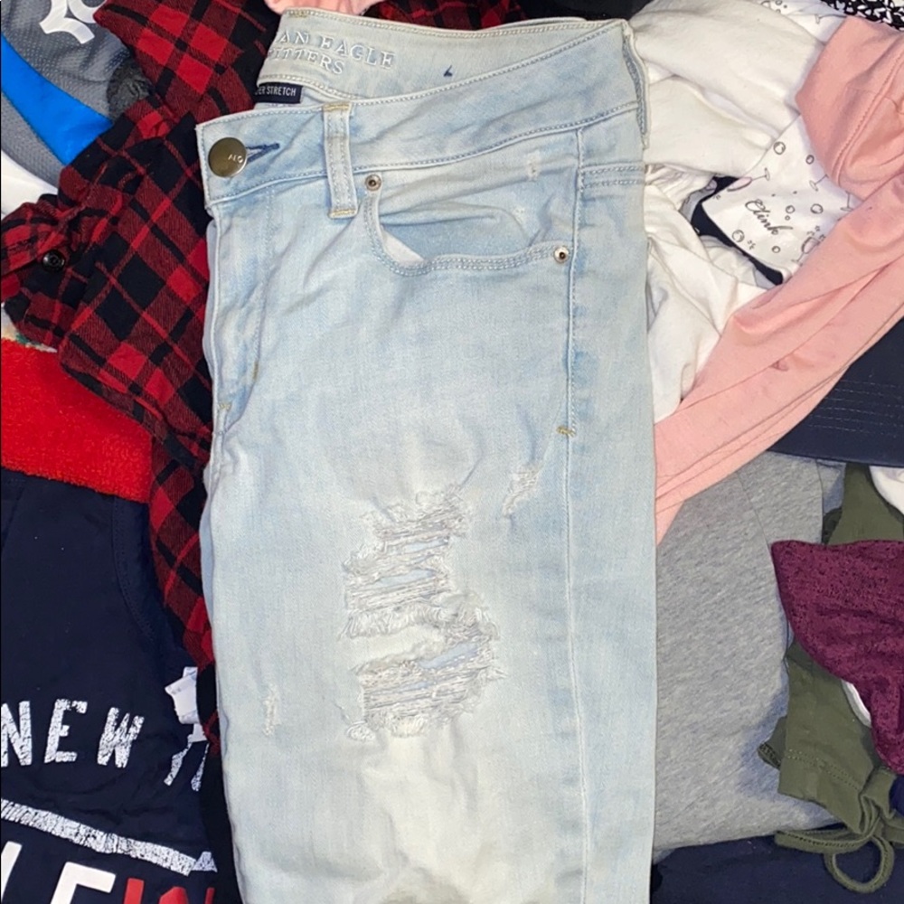 Light colored ripped jeans